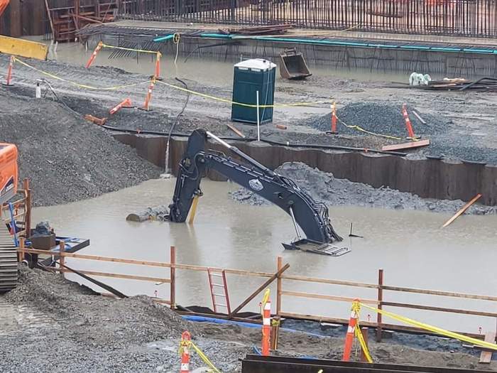 “Hey guys, our excavator fell into the texture overnight” - The photo, Building, Excavator, Shower, Drowned, Technics, Reddit