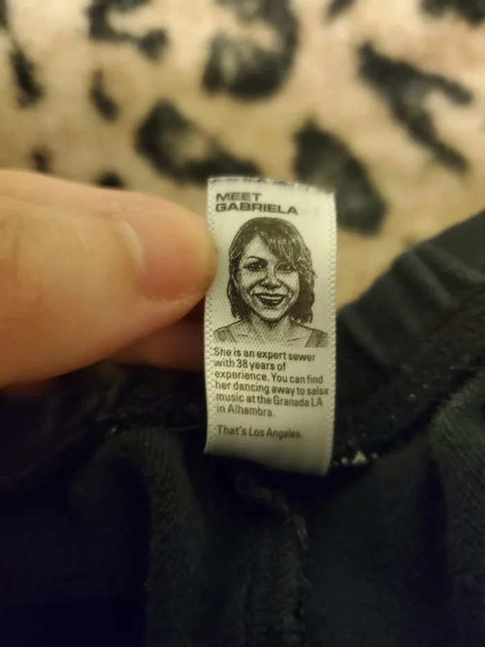 Label on a T-shirt with a portrait and the name of the girl who sewed it - The gods of marketing, Shortcuts, Seamstress