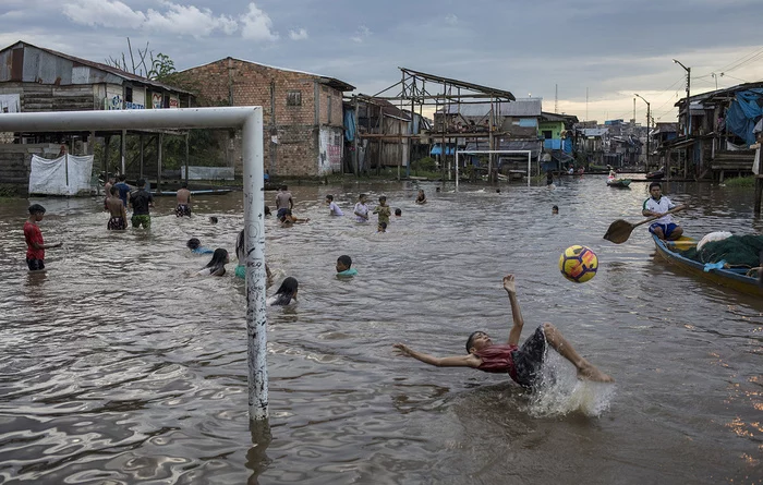 Football - Footballers, Children, Peru, Flood