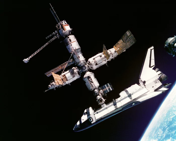 Docking of shuttle Atlantis with orbital station Mir - Roscosmos, Space station, Peace, shuttle, NASA