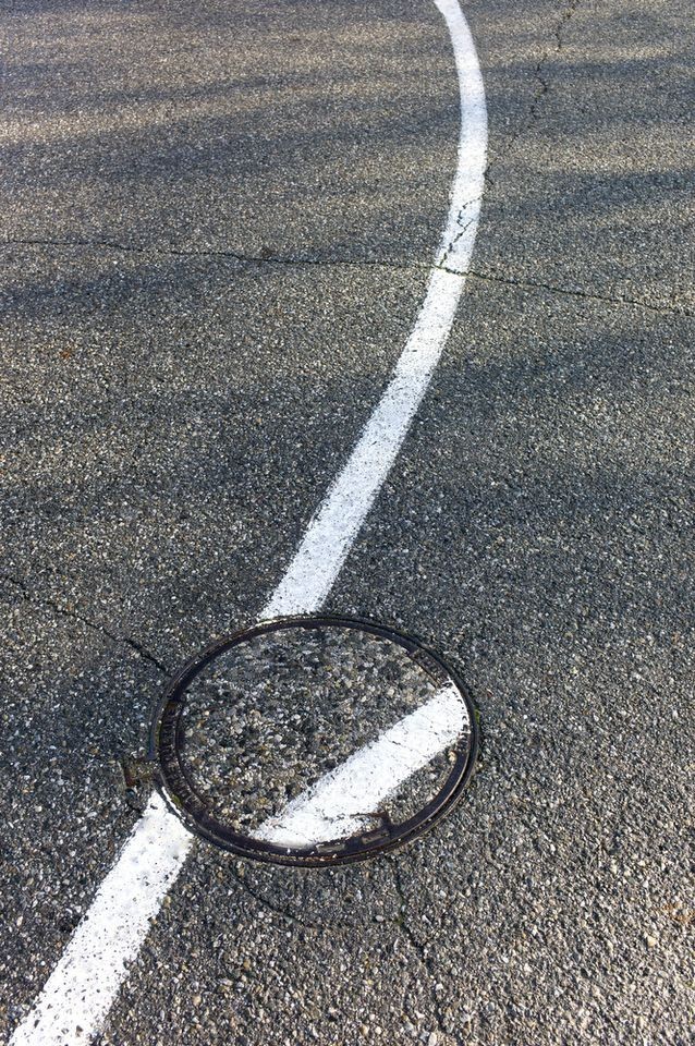 And so it will go. France, 2011 - Road markings, Sewer hatch, Nightmare, Crooked, Asphalt, Black and white photo, The photo