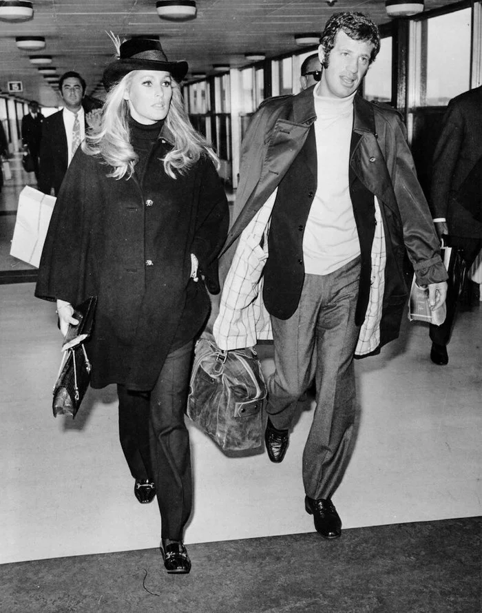 The first Bond girl Ursula Andress and Jean-Paul Belmondo at the airport, 1968, London - The photo, London, Jean-Paul Belmondo, Ursula Andress, Actors and actresses
