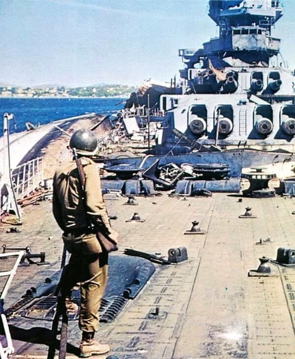 US Army soldier on the deck of Strasbourg - Battleship, France, The Second World War, The photo