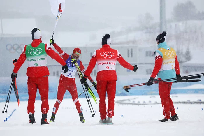 The Russian team won the men's relay at the 2022 Winter Olympics - Olympics 2022, Relay race, Men, Skis, Gold, Victory, Text, Russia