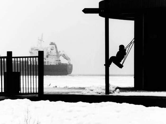 Swing with fairway view - My, The photo, Street photography, Black and white, Kronstadt, Silhouette, Children, Ship, Winter