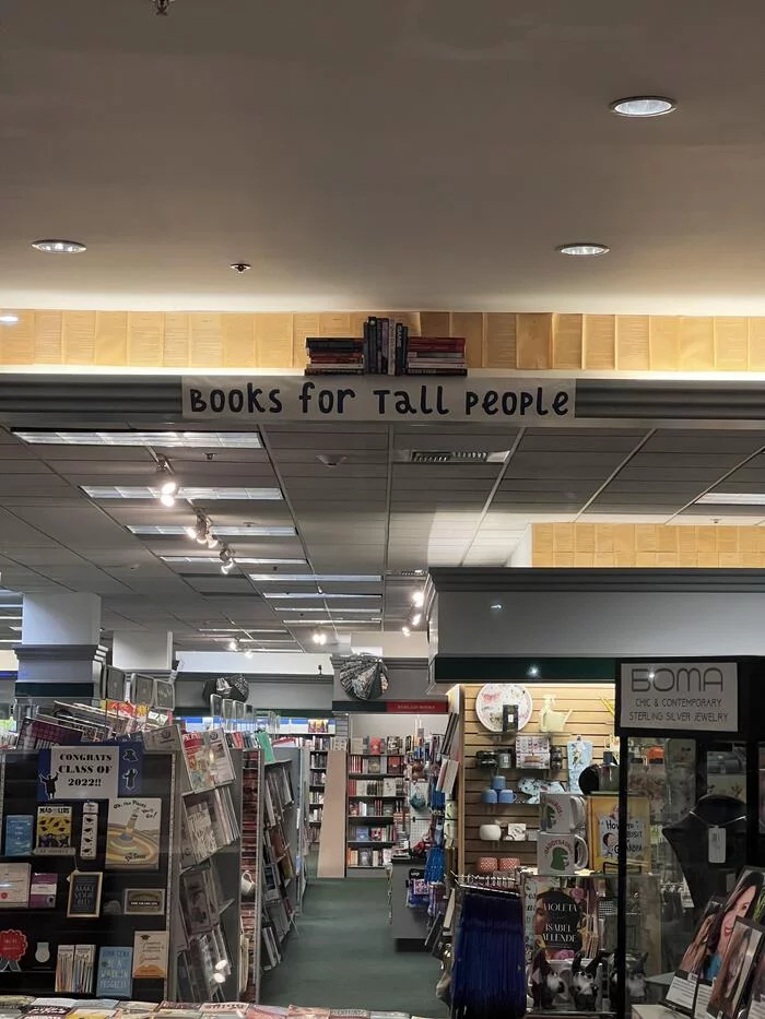 Shelf with books for tall people in a bookstore - The photo, Books, Score, Height, A shelf, Reddit, Los Angeles, Humor