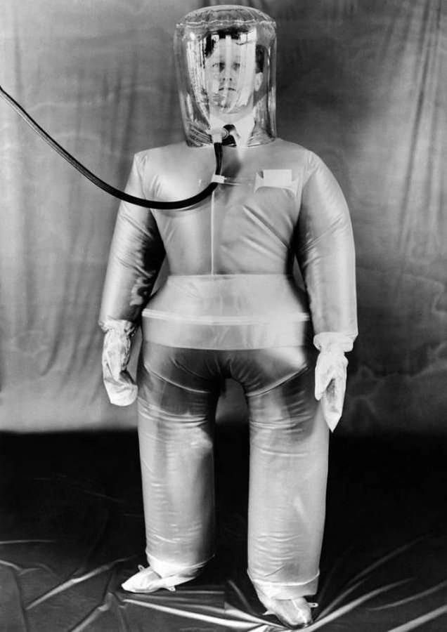 A plastic inflatable suit to protect British nuclear workers from radioactive dust and particles. 1954 - The photo, Black and white photo, Black and white, 50th