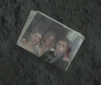 The only photo of Sam's wife (before the temporal rain hit the photo) - Death stranding, The photo