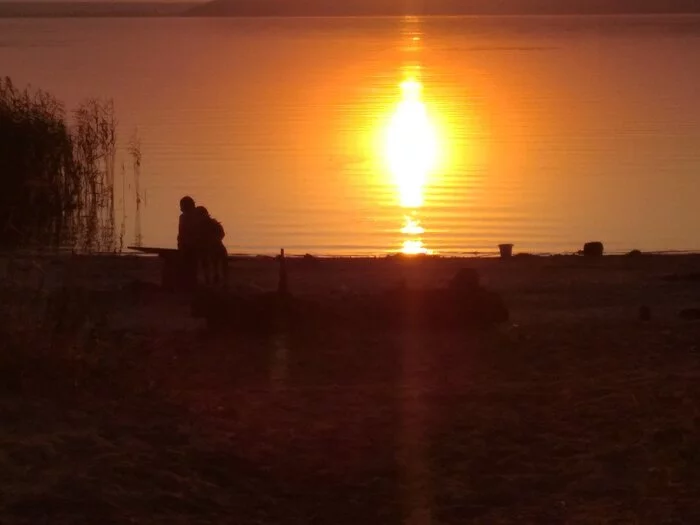 Hooked on the last warm days before school on the Volga. Two brothers see off the sun - Volga river, Relaxation, Wild tourism, Photo on sneaker, The sun