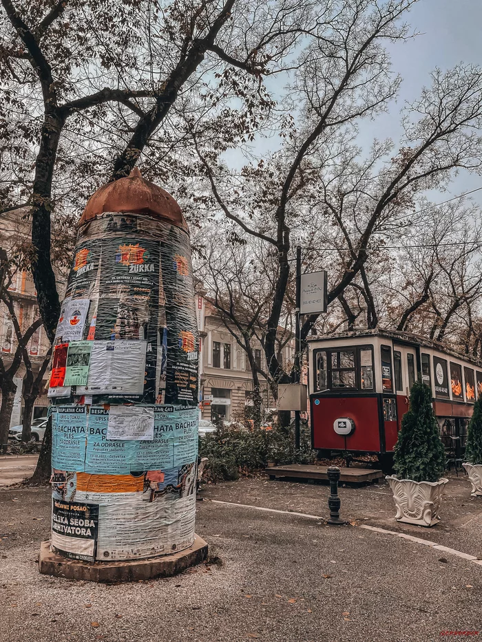 An old advertising stand and a retro tram converted into a cafe - My, Outdoor advertising, Tram, Retro, The street, Town, Serbia, The photo, Mobile photography