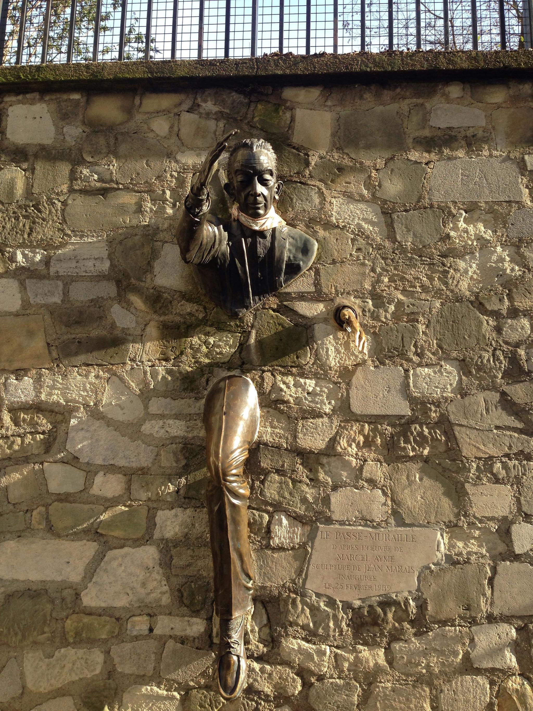 I'm trying to figure out what Jean Marais wanted to say with his sculpture Passing through the wall - Wall, Sculpture, Jean Marais