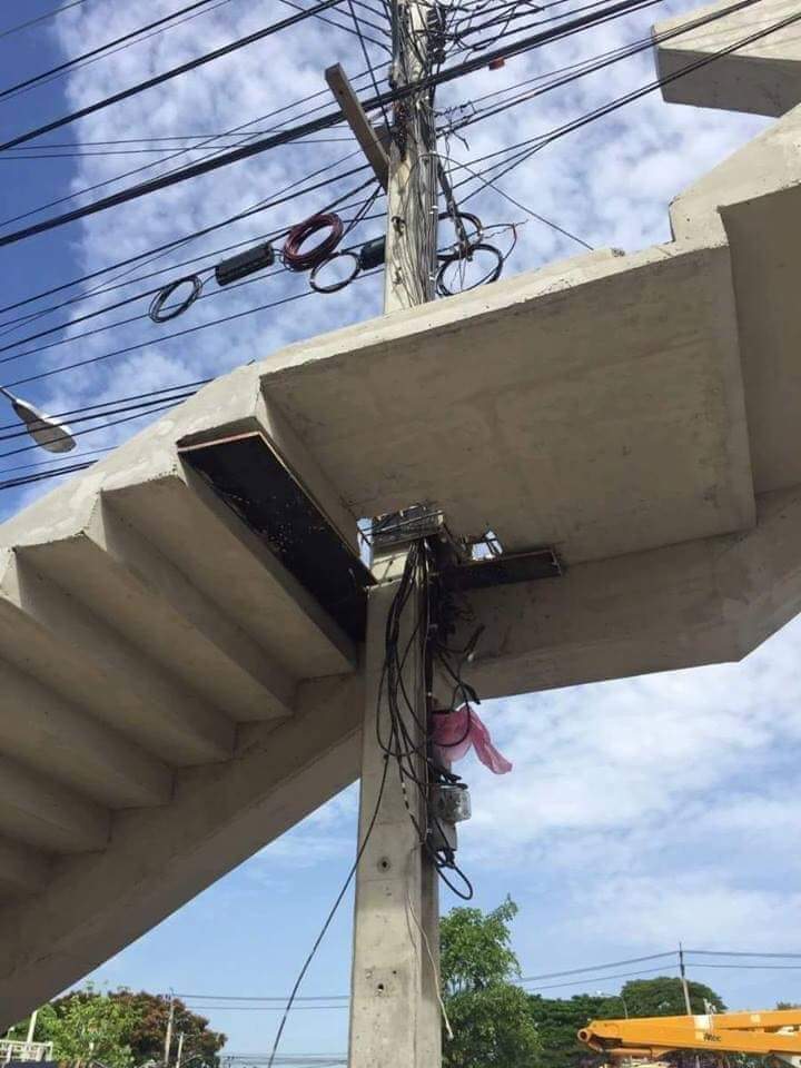 A rare natural phenomenon: a pole sprouted through a pedestrian crossing - Thailand, Pillar, Crosswalk, Savvy, Humor