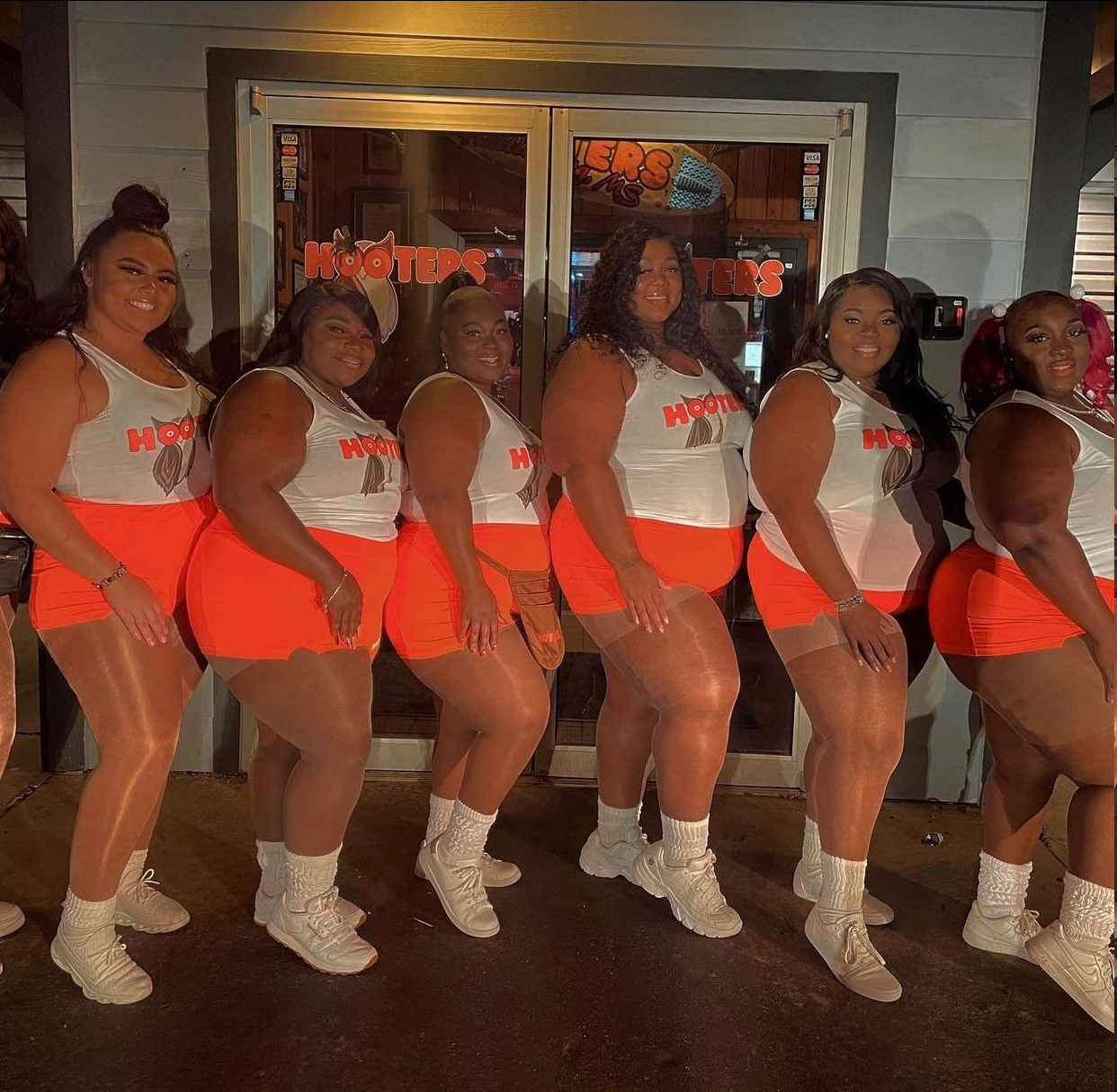 A good example of how the United States has changed in a couple of years - USA, Hooters, Waiters, Natural beauty, Obesity