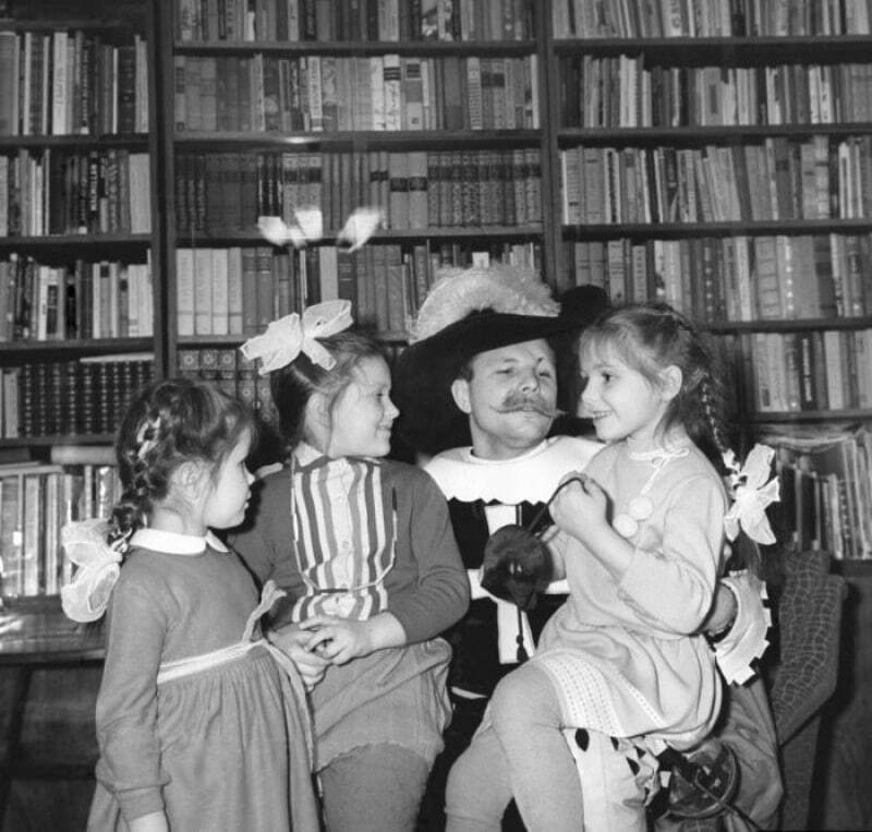 Yuri Gagarin in a Musketeer costume celebrates the New Year 1965 with his family - Old photo, Black and white photo, Yuri Gagarin, New Year